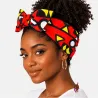 Femme noire portant un bandeau wax rouge/jaune – coiffure avec cheveux naturels